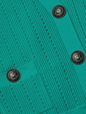 Close-up of the Irvin Pointelle Knit Cardigan in teal, showcasing a vertical ribbed texture, a small pocket, three intricately designed round silver buttons, and subtle pointelle knit details.