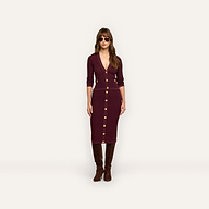 A person wearing a burgundy Melania Pointelle Knit Skirt with a matching cardigan, dark sunglasses, and knee-high boots.