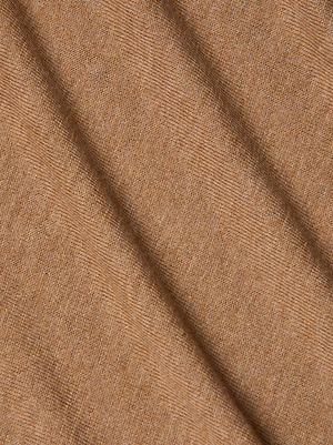 Close-up of the Flora Turtleneck by L'AGENCE, featuring soft, light brown fabric with diagonal folds that showcase its smooth and finely woven silk texture.