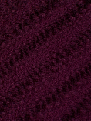 Close-up of the Kamdyn Cropped Sweater by L'AGENCE, featuring textured dark purple lightweight knit fabric with subtle diagonal ridges and fine woven details.