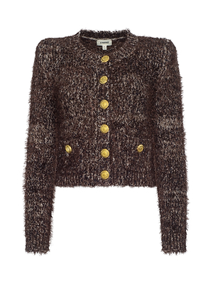 The Una Knit Cardigan is a brown, fuzzy cropped knit with long sleeves, front pockets, gold decorative buttons, a round neckline, and a chic silhouette.