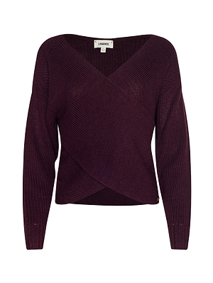 The Antonella Crossover Sweater by L’AGENCE is a maroon, long-sleeved knit with an oversized fit and deep V-neckline featuring a crisscross wrap front, shown on a plain white background.
