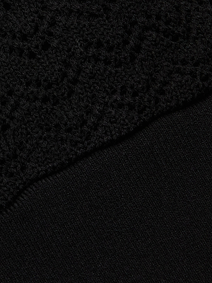 Close-up of two black fabrics on the Reverie Pointelle Knit Bralette: the upper part shows a lace-like pointelle knit, while the lower section features a smooth, tightly woven material.
