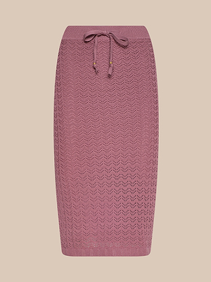 The Lacen Pointelle Knit Skirt is a mauve, midi-length crochet skirt featuring a subtle zigzag pattern and a breathable elastic waistband, shown against a neutral beige background.