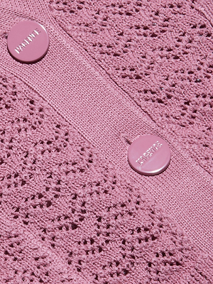 Close-up of the Orla Pointelle Knit Cardigan in mauve, featuring a lace-like pointelle pattern and two pink buttons with embossed lettering sewn onto a solid vertical band.