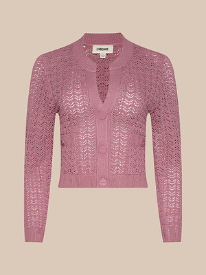 The Orla Pointelle Knit Cardigan is a mauve, long-sleeve button-up with a V-neck, front pockets, and textured openwork pattern. The L’AGENCE label appears inside the collar against a beige background.