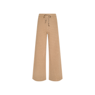 Tan wide-leg Gaelle Pointelle Knit Pant with a drawstring waist, perfect for vacation, displayed on a white background. Lightweight and stylish for warm-weather getaways.