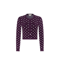 The Kota Cardigan Top, a dark purple long-sleeve essential cardigan featuring white polka dots, front buttons, and two chest pockets, is displayed on a plain white background.