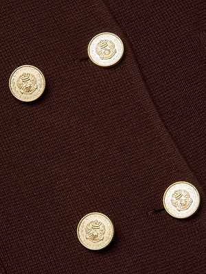 Close-up of four gold buttons embossed with floral designs on the Madilyn Knit Jacket by L'AGENCE, made from a dark brown textured knit.
