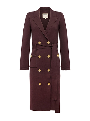 The Isabel Knit Coat is a long, burgundy double-breasted coat with gold buttons, wide notched lapel, two front pockets, and a matching waist belt. Sleek tailoring creates an elegant silhouette for timeless style.
