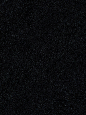 Close-up of the Salem Knit Skirt by L'AGENCE shows its dark, textured fabric with a slightly rough and fuzzy finish.