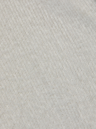 Close-up of the Guinevere Cropped Pullover’s ultra soft knit fabric, featuring diagonal ribbed lines that create a subtle pattern across the surface. The material appears cozy and plush.
