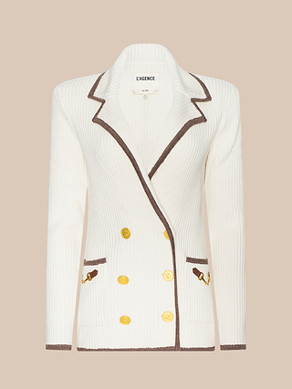 Ranch Knit Blazer in white ribbed knit, featuring brown trim, gold buttons, and two front pockets, displayed on a beige background.