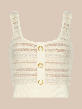 The Galene Tank is a cream-colored, sleeveless cropped knit top with textured horizontal stripes, delicate eyelash detailing, and three vintage-inspired buttons down the front, shown against a plain beige background.