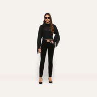 A person wearing a black Maddison Turtleneck with fringe on the sleeves, black pants with a gold-buckle belt, and black heels.