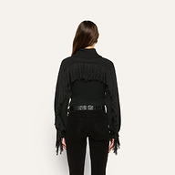 Back view of the black Maddison Turtleneck, a cropped sweater featuring fringe detail across the shoulders and down the sleeves.