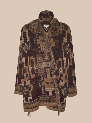 The Jair Cardigan, featuring earth-toned geometric patterns and fringe trim for a boho-chic style, is showcased against a plain light beige background.