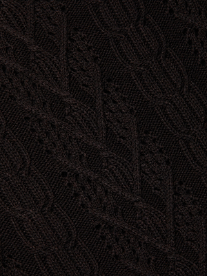 Close-up of the Kamdyn Cropped Sweater by L'AGENCE, featuring a dark brown cable knit with intricate leaf patterns and textured, raised stitching throughout.