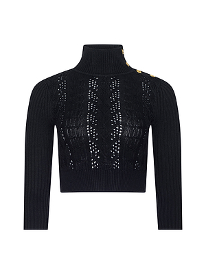 The Kamdyn Cropped Sweater is a black, long-sleeve knit with a high turtleneck, gold shoulder buttons, and openwork details—an elegant, Fall 2026 NYFW-inspired piece that channels historical romance.
