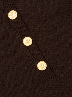 Close-up of the Elisabetta Knit Bodysuit in chocolate brown stretch ribbed fabric, featuring three gold embossed buttons arranged vertically along the trim of its long sleeve.