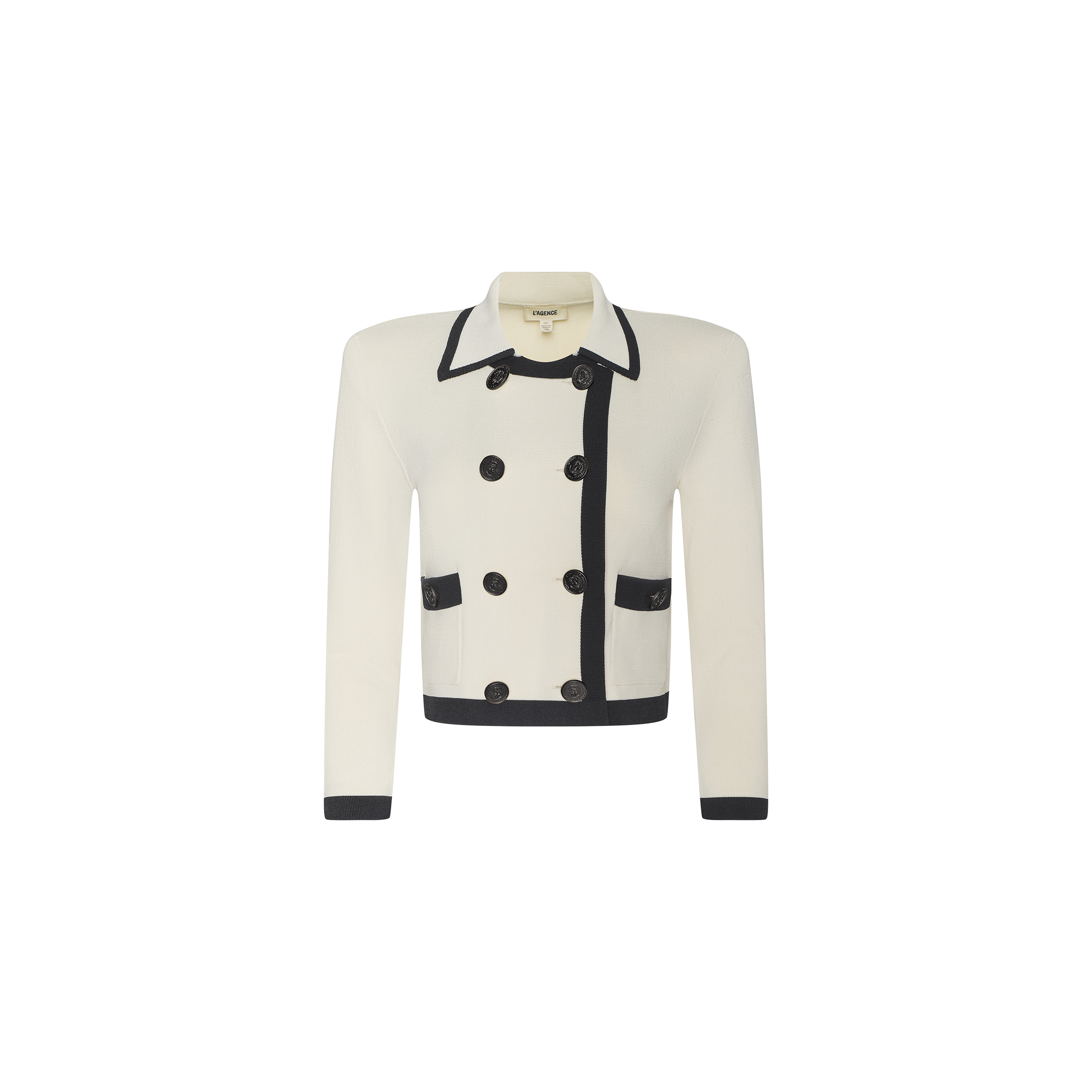Janu Cropped Knit Jacket: A white double-breasted knit jacket featuring black trim, two front pockets, black cuffs, dark buttons, and a collared neckline. The structured silhouette is enhanced with removable shoulder pads.