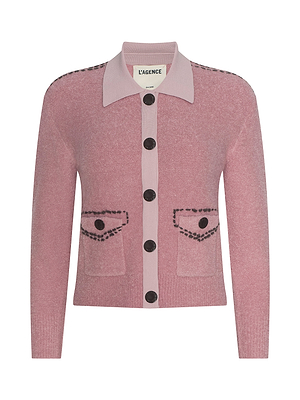 The Poetry Cardigan is a pink cropped style with a collar, black buttons, two front pockets, and black contrast trim. It features the label L’AGENCE inside.