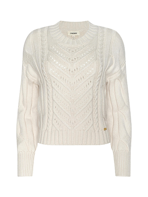 The Storm Cable-Knit Sweater by L'AGENCE is a cream, cropped long-sleeve knit with a round neckline, ribbed cuffs and hem, and a textured zigzag pattern on the front for added style.