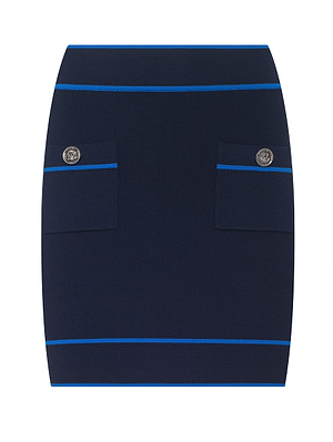 The Cecilia Knit Mini Skirt is a navy blue stretch knit mini skirt with two front pockets, each adorned with a silver decorative button, and thin horizontal blue stripes near the waist, pockets, and hem for refined simplicity.