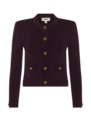 The Patsy Cropped Cardigan by L'AGENCE is a deep burgundy, collarless, long-sleeve power knit with gold buttons, ribbed trims, two front pockets, and gold button accents on the cuffs.