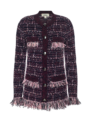 The Kastoria Fringe Cardigan by L'AGENCE is a longline, button-up style in purple, black, and pink boucle tweed with large buttons, front pockets, and pink fringe trim on the pockets, waist, and cuffs.