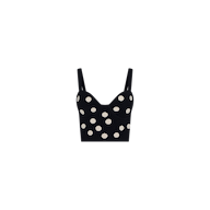 Tula Knit Bra Top in black, designed with jacquard polka dots, thin shoulder straps, and a fitted corset-style silhouette. Displayed on a plain white background.