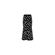 The Mae Knit Flare Skirt is a black, high-waisted, calf-length fit and flare skirt with a flared hem and a white polka dot pattern, shown against a plain white background.