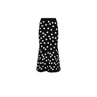 Mae Knit Flare Skirt in black jacquard with a polka dot pattern and a fit and flare silhouette.