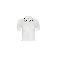 Ninette Knit Top: A white short-sleeve pointelle knit cardigan featuring a collar, front buttons, and black grosgrain ribbon trim along the button line and collar edges, displayed on a plain white background.