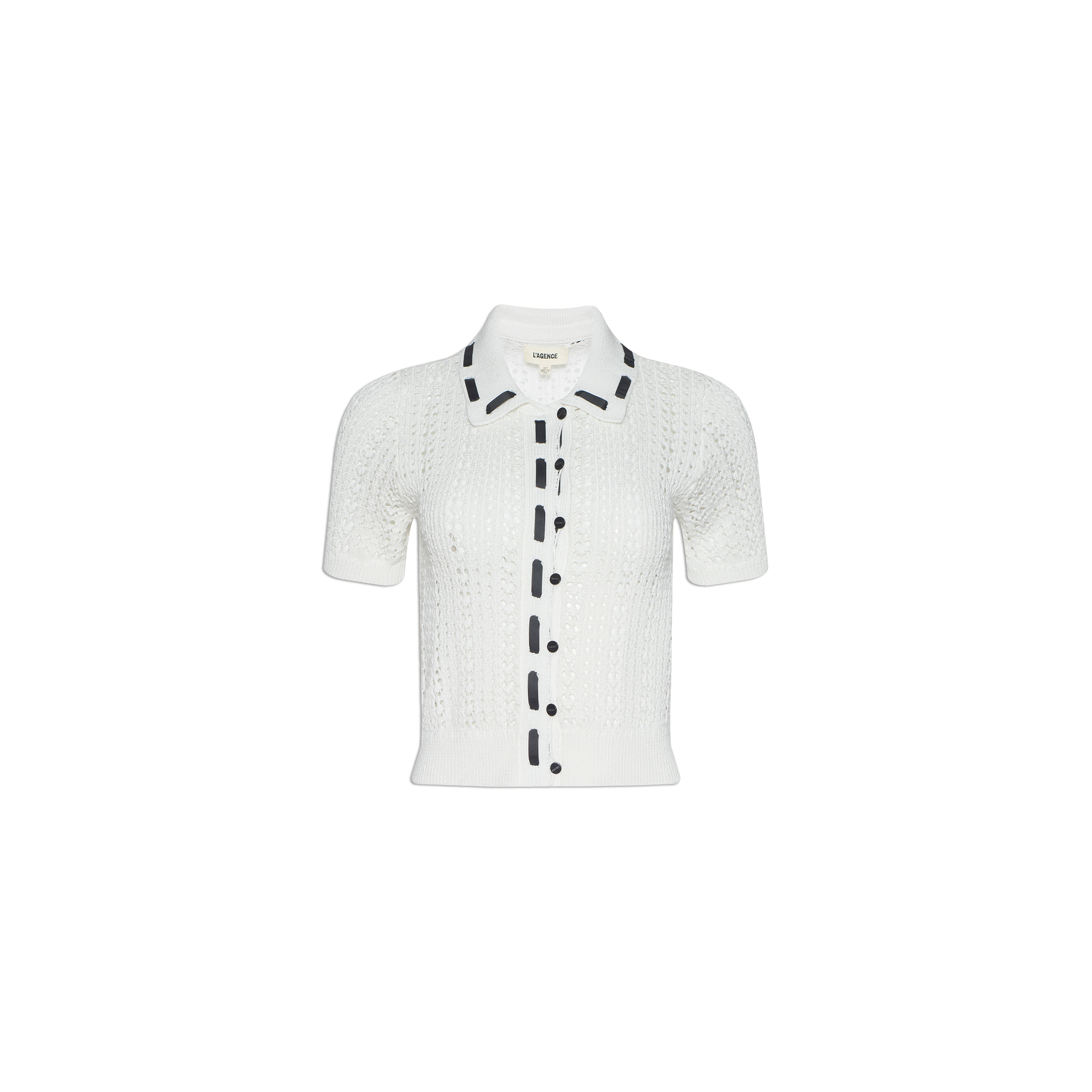 Ninette Knit Top: A white short-sleeve pointelle knit cardigan featuring a collar, front buttons, and black grosgrain ribbon trim along the button line and collar edges, displayed on a plain white background.