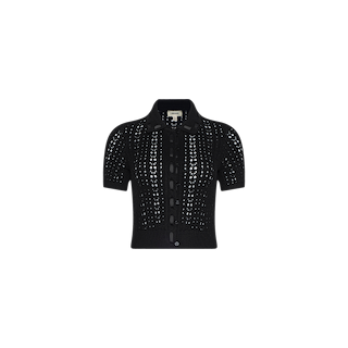 The Ninette Knit Top is a black, short-sleeve button-up crochet cardigan featuring a collar and subtle Parisian flair, displayed on a plain white background.