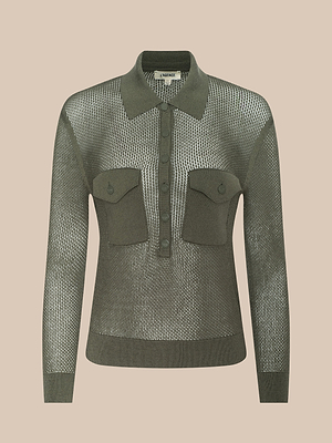 The Carine Top is a long-sleeved, olive green lightweight knit with a collar, button-down placket, and two buttoned chest pockets, shown against a beige background.