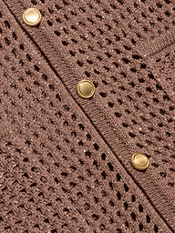 Close-up of the Mariana Pointelle Knit Shirt in brown, showcasing its airy, mesh-like pointelle pattern and a row of three round gold buttons along a ribbed edge.