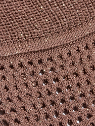 Close-up of the Tracy Bralette Top’s brown pointelle knit fabric, featuring sparkly thread, with a dense, tight weave on top and an open, lacy weave with small holes on the bottom.