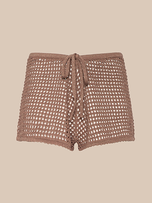 The Solan Pointelle Knit Short features a brown crochet design with a drawstring waist and open, net-like weave for beach style, shown against a plain beige background.