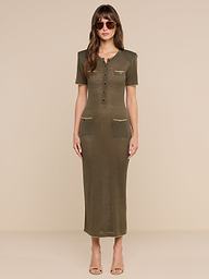 A woman wearing sunglasses and the Mel Knit Dress—a fitted, olive green midi dress with short sleeves, a button-front design, two chest pockets, and two hip pockets—stands against a plain white background.