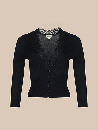 The Eluna Cardigan Top is a black featherweight wool-blend long-sleeve cardigan featuring lace trim around the neckline and buttons down the front, displayed on a plain beige background.