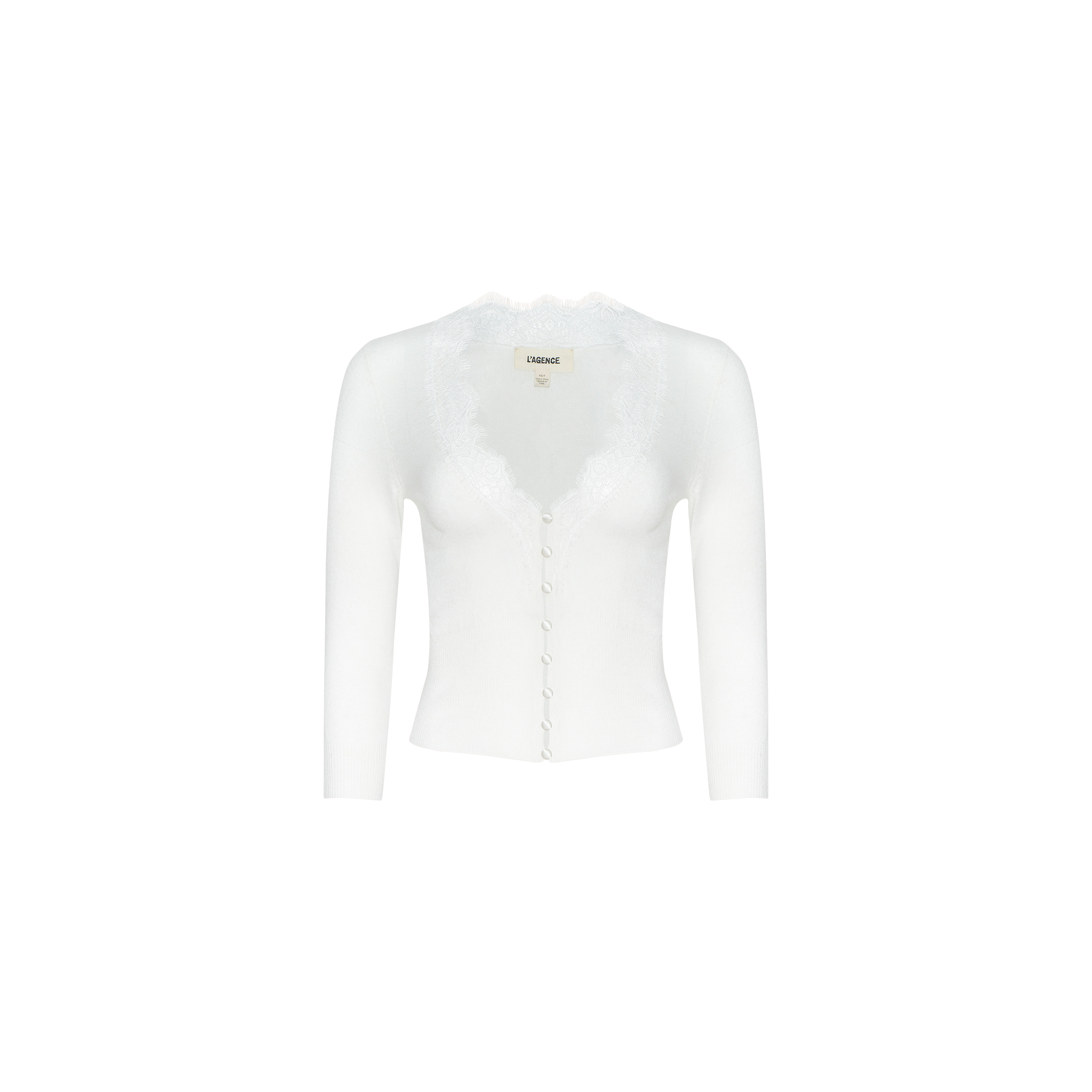 The Eluna Cardigan Top is a white, long-sleeve featherweight knit with front buttons and a delicate lace inset along the V-neckline, displayed on a plain background.