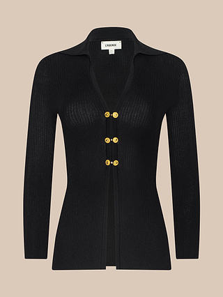 The Kaye Cardigan Top is a black ribbed knit long-sleeve cardigan featuring a collar and four gold buttons down the front, displayed on a plain beige background. Ideal for layering or pairing with your favorite travel set.