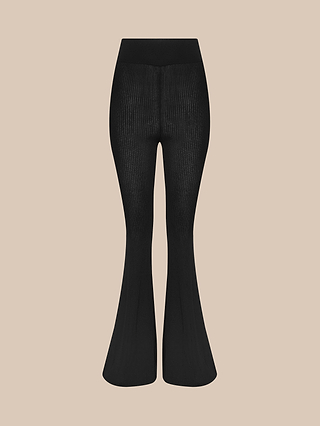 Conan Knit Pant in black, featuring a ribbed high-rise design with a flared silhouette, shown from the front against a plain beige background with no visible branding or embellishments.