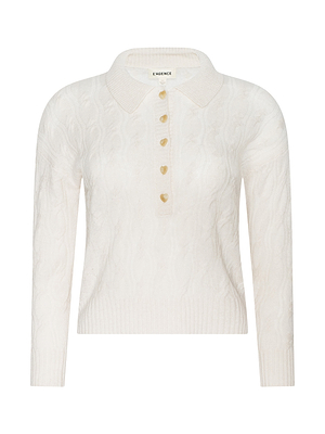 White cardigan with gold buttons on a white background