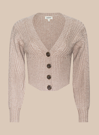 The Hail Cabled Cardigan is a cropped, beige, ribbed knit cardigan featuring long blouson sleeves and four dark brown buttons down the front, displayed on a plain beige background.