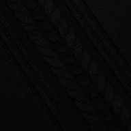 Sandrina Turtleneck in a black cable knit with a diagonal pattern and a relaxed fit.