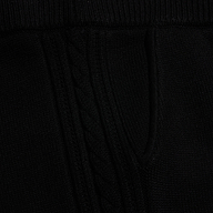 Close-up of the black Tamaris Cable Knit Pant, featuring soft fabric with a vertical cable knit pattern.