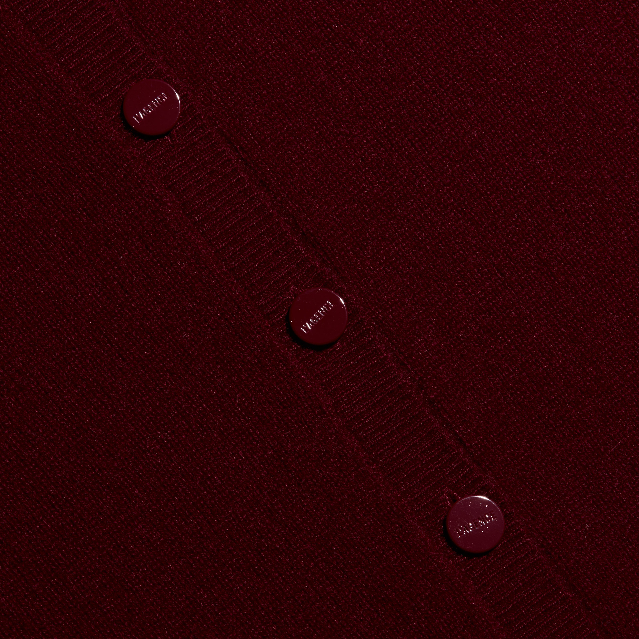 Malone Cashmere Cardigan in cherry red with a crewneck and matching buttons.